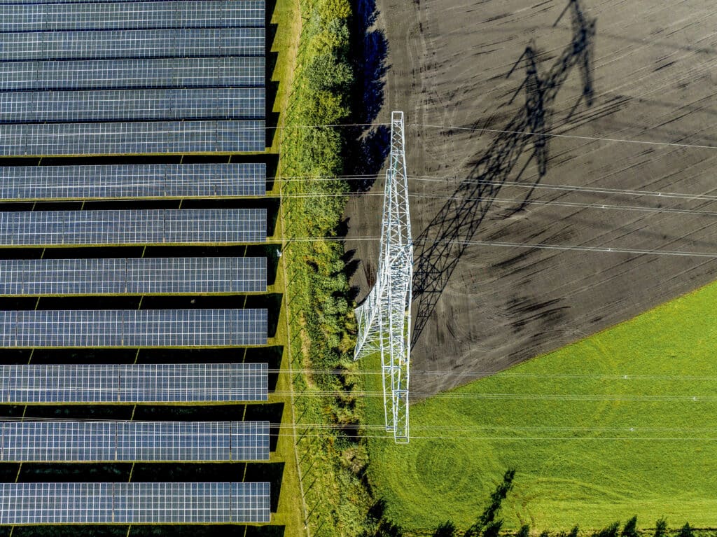 aerial view of solar panels by a green field and p 2024 03 01 02 37 26 utc